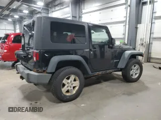 2009 Jeep Wrangler Rubicon with VIN 1J4GA64159L770895, listed as a Copart auction lot 82140864 with 209,464 mi miles and Salvage Title. Bid and sale history available at DreamBid. Image 3.