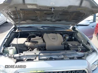 2018 Toyota Tacoma SR5 with VIN 3TMAZ5CN0JM053861, listed as a IAAI auction lot 41920377 with 104,015 mi miles and . Bid and sale history available at DreamBid. Image 10.