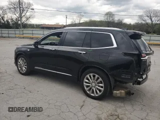 2021 Cadillac XT6 Premium Luxury z VIN 1GYKPCRS1MZ169952, wystawiony jako Copart lot #51908895 z przebiegiem 31 834 mil mil oraz Szkody całkowita. Historia ofert i sprzedaży dostępna na DreamBid. Obrazek 2.