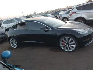 2019 Tesla Model 3 Long Range with VIN 5YJ3E1EBXKF393329, listed as a IAAI auction lot 41586996 with 70,269 mi miles. Bid and sale history available at carsss.com. Image 14.