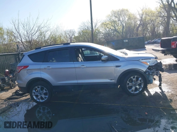2013 Ford Escape SEL with VIN 1FMCU0HX4DUB98238, listed as a IAAI auction lot 41973221 with 131,590 mi miles and . Bid and sale history available at DreamBid. Image 14.