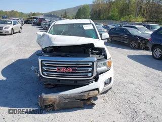 2019 GMC Canyon 4WD SLE z VIN 1GTG6CEN0K1353094, wystawiony jako IAAI lot #42065160 z przebiegiem 73 235 mil mil oraz . Historia ofert i sprzedaży dostępna na DreamBid. Obrazek 12.