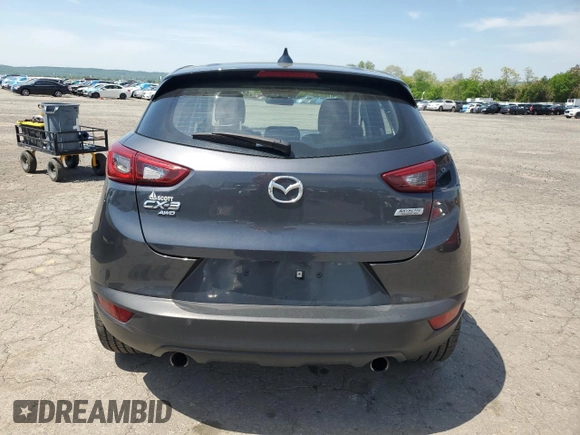 2017 Mazda CX-3 Touring z VIN JM1DKFC76H0149368, wystawiony jako Copart lot #55747305 z przebiegiem 47 946 mil mil oraz Szkoda całkowita • Salvage title. Historia ofert i sprzedaży dostępna na DreamBid. Obrazek 6.