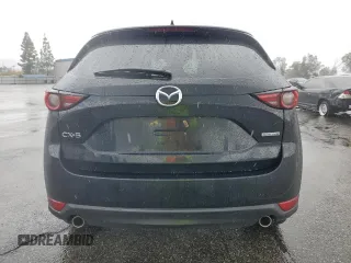 2020 Mazda CX-5 Grand Touring with VIN JM3KFADM3L0815055, listed as a Copart auction lot 48175245 with 56,602 mi miles and Salvage Title. Bid and sale history available at carsss.com. Image 6.