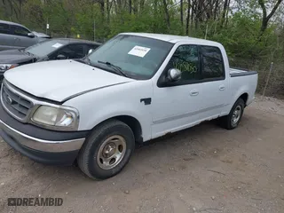 2001 Ford F-150 SuperCrew XLT with VIN 1FTRW07LX1KA24415, listed as a IAAI auction lot 42081030 with 298,673 mi miles. Bid and sale history available at carsss.com. Image 2.