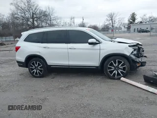2020 Honda Pilot Touring 8-Passenger with VIN 5FNYF6H96LB056229, listed as a IAAI auction lot 41738249 with 65,099 mi miles and . Bid and sale history available at DreamBid. Image 14.
