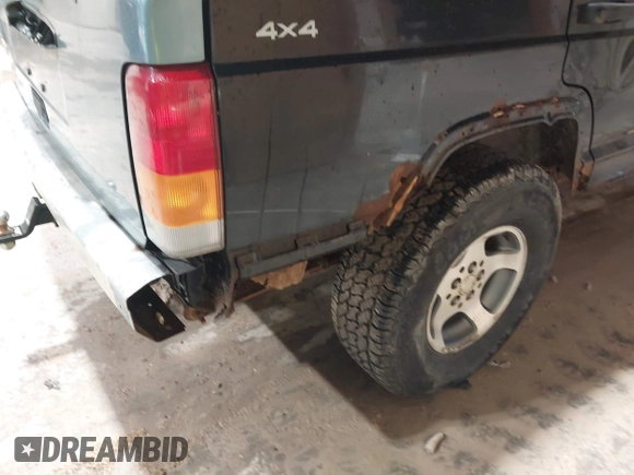 1998 Jeep Cherokee Sport z VIN 1J4FJ68S2WL142027, wystawiony jako IAAI lot #42305669 z przebiegiem 249 580 mil mil oraz . Historia ofert i sprzedaży dostępna na DreamBid. Obrazek 13.