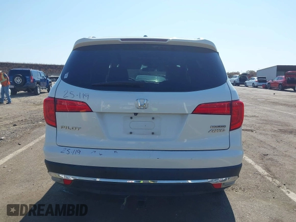 2018 Honda Pilot Touring with VIN 5FNYF6H95JB019122, listed as a IAAI auction lot 42439283 with 128,848 mi miles and . Bid and sale history available at DreamBid. Image 16.