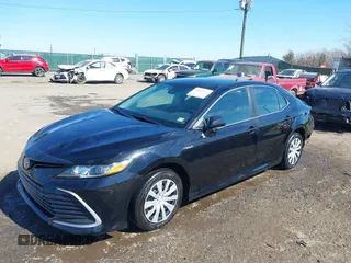 2021 Toyota Camry Hybrid LE with VIN 4T1C31AK4MU553612, listed as a IAAI auction lot 41609111 with 34,399 mi miles. Bid and sale history available at carsss.com. Image 2.