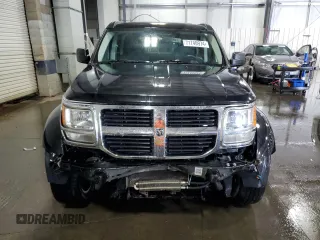 2008 Dodge Nitro SLT z VIN 1D8GU58KX8W206104, wystawiony jako Copart lot #71740974 z przebiegiem 236 981 mil mil oraz Szkoda całkowita • Salvage title. Historia ofert i sprzedaży dostępna na DreamBid. Obrazek 5.