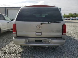 2006 Cadillac Escalade z VIN 1GYEK63N76R136618, wystawiony jako Copart lot #58990945 z przebiegiem Nie podano mil oraz Czysty tytuł • Clean title. Historia ofert i sprzedaży dostępna na DreamBid. Obrazek 6.