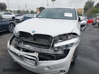 2018 BMW X5 xDrive40e iPerformance with VIN 5UXKT0C58J0V99415, listed as a IAAI auction lot 41391474 with 124,671 mi miles. Bid and sale history available at carsss.com. Image 6.