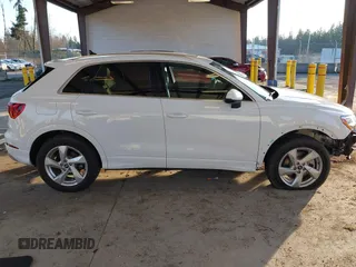 2021 Audi Q3 Premium with VIN WA1AUCF37M1087692, listed as a IAAI auction lot 41277380 with 66,039 mi miles and . Bid and sale history available at DreamBid. Image 14.