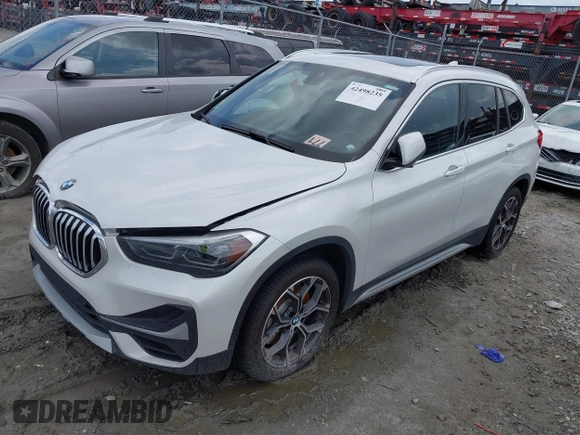 2021 BMW X1 xDrive28i z VIN WBXJG9C09M5T94206, wystawiony jako IAAI lot #42498235 z przebiegiem 62 079 mil mil oraz . Historia ofert i sprzedaży dostępna na DreamBid. Obrazek 2.
