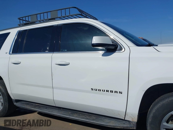 2019 Chevrolet Suburban LT with VIN 1GNSCHKC3KR143942, listed as a IAAI auction lot 41896633 with 153,139 mi miles and . Bid and sale history available at DreamBid. Image 13.