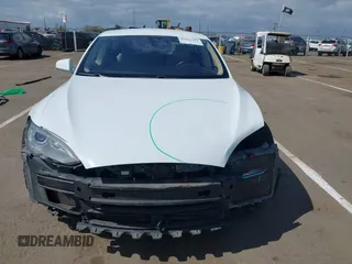 2014 Tesla Model S 60 with VIN 5YJSA1H10EFP56526, listed as a IAAI auction lot 41871784 with 143,361 mi miles and . Bid and sale history available at DreamBid. Image 13.