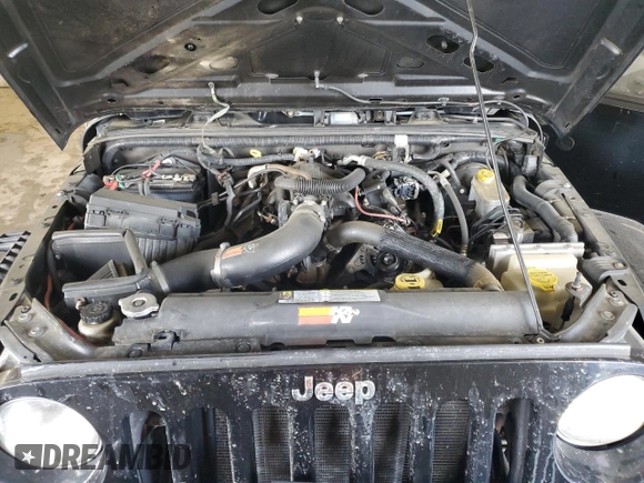 2009 Jeep Wrangler Sahara with VIN 1J4FA54159L772622, listed as a Copart auction lot 55648305 with 141,880 mi miles and Salvage title. Bid and sale history available at DreamBid. Image 11.