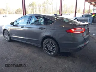 2013 Ford Fusion Titanium Hybrid with VIN 3FA6P0RU0DR277092, listed as a IAAI auction lot 41811079 with 123,071 mi miles. Bid and sale history available at carsss.com. Image 3.