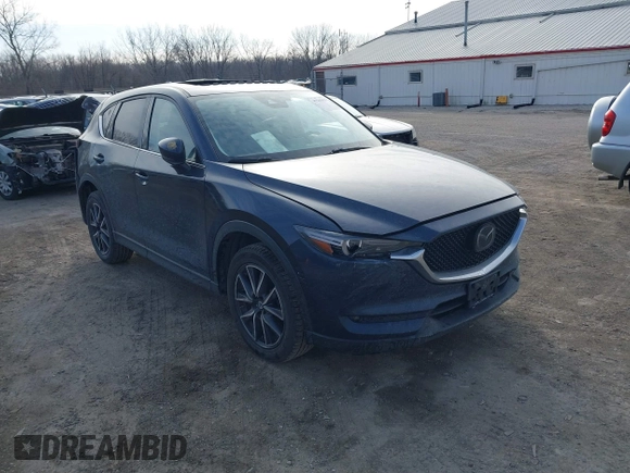 2018 Mazda CX-5 Grand Touring with VIN JM3KFBDM7J0338665, listed as a IAAI auction lot 41546019 with 141,740 mi miles. Bid and sale history available at carsss.com. Image 1.
