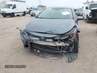 2021 Toyota Corolla Hybrid LE with VIN JTDEAMDE8MJ002711, listed as a IAAI auction lot 41498716 with 98,559 mi miles. Bid and sale history available at carsss.com. Image 6.