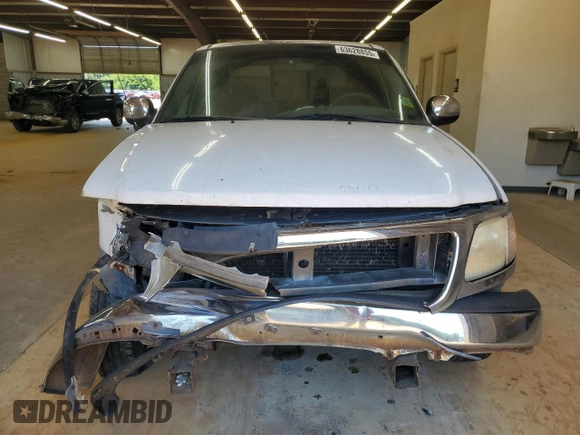 2001 Ford F-150 XLT with VIN 1FTRW07W51KE03221, listed as a Copart auction lot 63628855 with 237,510 mi miles and Salvage title. Bid and sale history available at DreamBid. Image 5.
