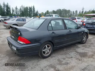 2002 Mitsubishi Lancer OZ-Rally z VIN JA3AJ86EX2U059845, wystawiony jako IAAI lot #42371709 z przebiegiem 207 665 mil mil oraz . Historia ofert i sprzedaży dostępna na DreamBid. Obrazek 4.