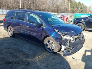 2020 Honda Odyssey Touring with VIN 5FNRL6H89LB015744, listed as a IAAI auction lot 41495735 with 106,440 mi miles and . Bid and sale history available at DreamBid. Image 1.