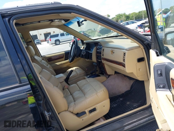 1995 Jeep Grand Cherokee Limited with VIN 1J4GZ78Y0SC578277, listed as a IAAI auction lot 42082848 with 174,288 mi miles. Bid and sale history available at carsss.com. Image 5.