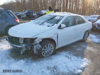 2014 Toyota Camry Hybrid LE with VIN 4T1BD1FK7EU114181, listed as a IAAI auction lot 41294936 with 115,986 mi miles. Bid and sale history available at carsss.com. Image 2.