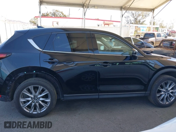 2020 Mazda CX-5 Grand Touring z VIN JM3KFADMXL0740144, wystawiony jako IAAI lot #41830203 z przebiegiem 70 535 mil mil oraz . Historia ofert i sprzedaży dostępna na DreamBid. Obrazek 13.