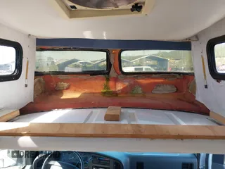 1996 Ford Econoline Cargo z VIN 1FDHS24H9THA55752, wystawiony jako IAAI lot #42052800 z przebiegiem 117 680 mil mil oraz . Historia ofert i sprzedaży dostępna na DreamBid. Obrazek 20.