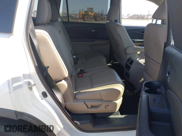 2018 Honda Pilot Touring with VIN 5FNYF6H95JB019122, listed as a IAAI auction lot 42439283 with 128,848 mi miles and . Bid and sale history available at DreamBid. Image 8.