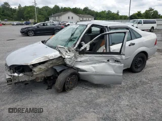 2007 Ford Focus S with VIN 1FAHP34N67W221816, listed as a Copart auction lot 64971935 with 187,886 mi miles and Salvage title. Bid and sale history available at DreamBid. Image 1.