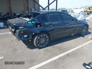 2018 BMW 5 Series 530e xDrive with VIN WBAJB1C51JB374308, listed as a IAAI auction lot 41965038 with 122,791 mi miles and . Bid and sale history available at carsss.com. Image 4.