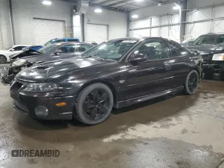 2006 Pontiac GTO z VIN 6G2VX12U06L500780, wystawiony jako Copart lot #55749885 z przebiegiem 121 394 mil mil oraz Szkoda całkowita • Salvage title. Historia ofert i sprzedaży dostępna na DreamBid. Obrazek 1.
