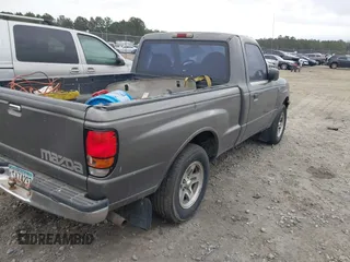 2000 Mazda B-Series Truck SX with VIN 4F4YR12C9YTM23599, listed as a IAAI auction lot 41393276 with 232,789 mi miles and . Bid and sale history available at DreamBid. Image 4.