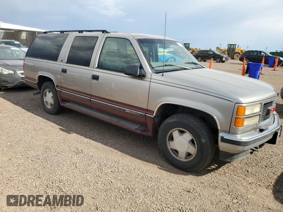 1998 GMC Suburban with VIN 1GKFK16RXWJ721305, listed as a Copart auction lot 64112165 with 197,756 mi miles and Clean title. Bid and sale history available at DreamBid. Image 4.