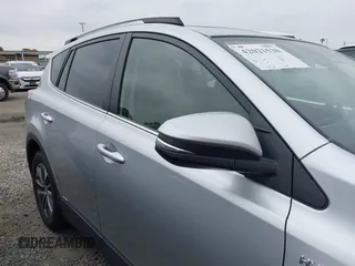 2016 Toyota RAV4 Hybrid XLE with VIN JTMRJREVXGD029019, listed as a IAAI auction lot 42021530 with 74,400 mi miles. Bid and sale history available at carsss.com. Image 14.