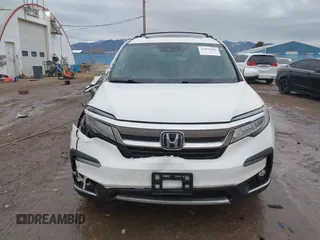 2021 Honda Pilot Elite with VIN 5FNYF6H03MB044154, listed as a IAAI auction lot 41050202 with 60,331 mi miles and . Bid and sale history available at DreamBid. Image 12.