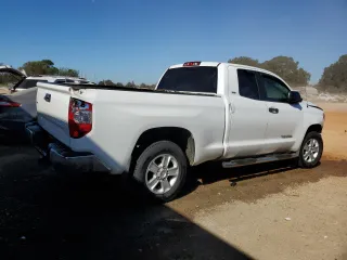 2014 Toyota Tundra SR with VIN 5TFRM5F11EX081176, listed as a Copart auction lot 77394444 with 110,584 mi miles and Salvage title. Bid and sale history available at DreamBid. Image 3.