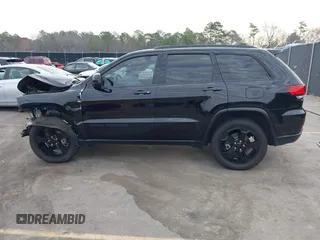 2019 Jeep Grand Cherokee Laredo E with VIN 1C4RJEAGXKC571770, listed as a IAAI auction lot 41677487 with 113,089 mi miles. Bid and sale history available at carsss.com. Image 14.