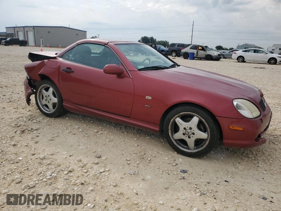 1999 Mercedes-Benz SLK-Class with VIN WDBKK47F0XF132802, listed as a Copart auction lot 69818544 with 123,026 mi miles and Salvage Title. Bid and sale history available at carsss.com. Image 4.