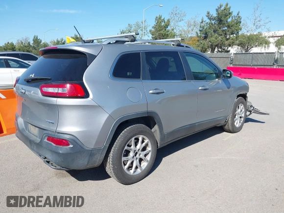 2015 Jeep Cherokee Latitude z VIN 1C4PJMCB0FW749323, wystawiony jako IAAI lot #41852102 z przebiegiem 162 060 mil mil oraz . Historia ofert i sprzedaży dostępna na DreamBid. Obrazek 4.