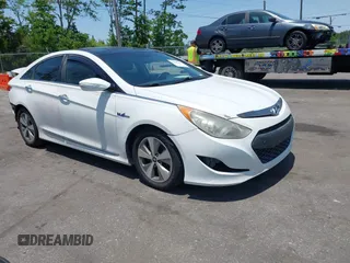 2012 Hyundai Sonata Hybrid z VIN KMHEC4A40CA054589, wystawiony jako IAAI lot #42281152 z przebiegiem 143 049 mil mil oraz . Historia ofert i sprzedaży dostępna na DreamBid. Obrazek 1.