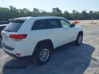 2020 Jeep Grand Cherokee Laredo E with VIN 1C4RJFAG1LC389026, listed as a IAAI auction lot 42261396 with 100,409 mi miles and . Bid and sale history available at DreamBid. Image 4.