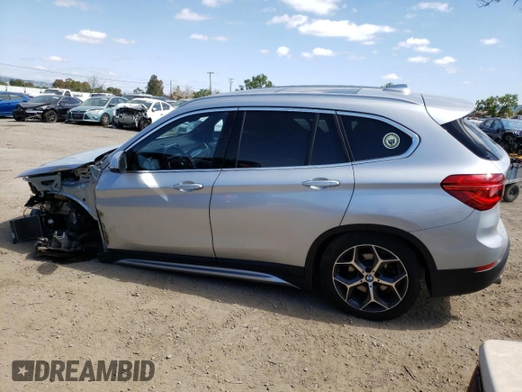 2018 BMW X1 sDrive28i with VIN WBXHU7C38J3H42948, listed as a Copart auction lot 52061793 with 26,991 mi miles and . Bid and sale history available at DreamBid. Image 2.