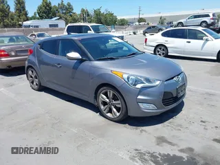 2014 Hyundai Veloster RE:FLEX with VIN KMHTC6AD8EU201052, listed as a IAAI auction lot 42644504 with 128,679 mi miles and . Bid and sale history available at DreamBid. Image 1.