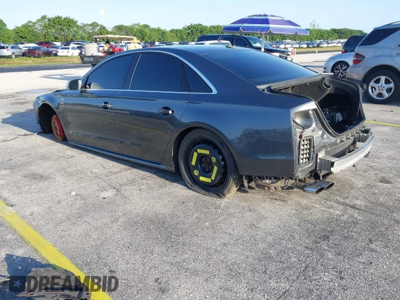 2015 Audi S8 z VIN WAUK2AFD5FN021986, wystawiony jako IAAI lot #41986491 z przebiegiem 142 073 mil mil oraz . Historia ofert i sprzedaży dostępna na DreamBid. Obrazek 3.