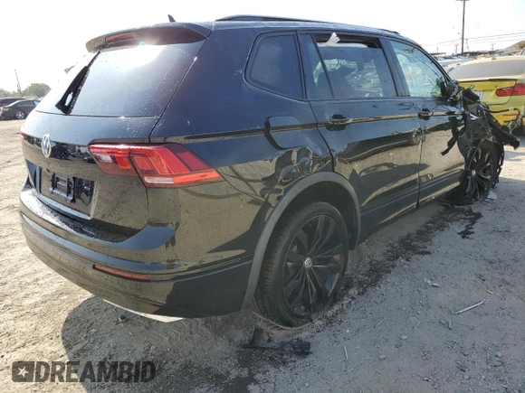 2021 Volkswagen Tiguan SE with VIN 3VV3B7AXXMM069410, listed as a Copart auction lot 58994325 with 55,846 mi miles and Salvage title. Bid and sale history available at DreamBid. Image 3.