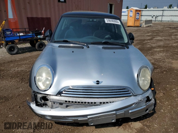 2004 MINI Hardtop with VIN WMWRC33454TJ56308, listed as a Copart auction lot 59690865 with 99,374 mi miles and Salvage title. Bid and sale history available at DreamBid. Image 5.